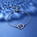 Macro shot of silver wave pendant bracelet with S925 engraved heart tag on blue water background - Wave Style (XLY112)