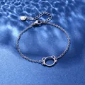 Detail of stainless steel bracelet with hollow cat charm on blue silk background - Cat Head Style (XLY114)