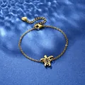 Detailed close-up of golden stainless steel bracelet featuring a delicate hollow turtle charm - Hollow Sea Turtle Style (XLJ115)
