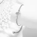 Silver stainless steel daisy pendant bracelet with adjustable heart tag and o-chain - April