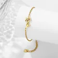 Bracelet doré en acier inoxydable avec pendentif ajouré de fleur de naissance de décembre - Mars