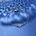 Detailed shot of silver sun pendant bracelet with lobster clasp and heart charm extension - Sun Style (XLY119)