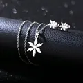 Polished stainless steel flower necklace and stud earrings set with leaf-shaped pendants - Hollow Maple Leaf Style (TZ-413)
