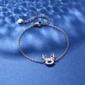 Detail of silver stainless steel reindeer pendant bracelet on blue ripple background - Reindeer Style (XLY120)