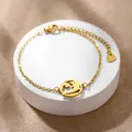 Gold stainless steel dolphin charm bracelet with hollow circular design and fine chain link - Dolphin (XLJ176)