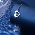 Close-up of stainless steel bracelet featuring a minimalist heart dolphin charm - Dolphin Heart Style (XLY124)