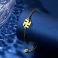 Detailed macro view of golden charm bracelet with swastika symbol on blue display stand - Swastika Symbol Style (XLJ126)