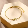 Minimalist gold stainless steel bracelet with cutout rose pendant on wooden block - Rose Flower (XLJ188)