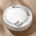 Vista dettagliata del bracciale in acciaio inossidabile argento con pendente Om e cuore - Stile Simbolo Om Yoga (XLY176) / Argento
