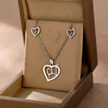 Stainless steel jewelry set featuring hollow heart and cat silhouette necklace and earrings - Hollow Heart Cat Style (TZ-477)