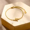 Detail of a gold stainless steel chain bracelet with a hollow hexagonal windmill charm - Hexagonal Windmill (XLJ186)