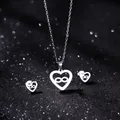 Polished silver heart jewelry set with infinity symbol on a sparkling black background - Heart Infinity Symbol Style (TZ-401)