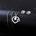 Detail of a minimalist heart-shaped stainless steel necklace and earring jewelry set - Nested Heart Silhouette Style (TZ-407)