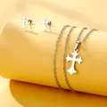 Close-up of silver stainless steel cross necklace and earring set on yellow background - Spiked Cross Style (TZ-411)