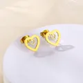 Close-up of golden hollow double heart stud earrings in minimalist stainless steel - Double Layer Wave Heart (SD10)