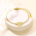 Bracciale in acciaio dorato con ciondolo a cuore traforato e sagoma di gatto - Oro (XLJ229)