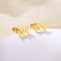 Macro shot of gold-plated stainless steel Baby letter stud earrings on a white stand - Baby Artistic Letters (SD23)