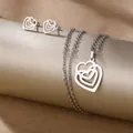 Polished stainless steel heart pendant necklace and stud earrings set on gold pedestals - Three-Layer Nested Heart (TZ-475)