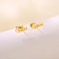 Macro shot of gold stainless steel Queen letter stud earrings with small crown detail - Queen Artistic Letters with Crown (SD33)