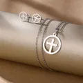 Detail view of stainless steel jewelry set featuring hollow cross pendant and earrings - Circle Cross (TZ-479)