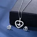 Detailed view of hollow heart and heartbeat pattern on silver steel necklace set - Heartbeat Heart Style (TZ-128)