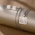 Detailed view of geometric stainless steel necklace and earrings with spiral pattern - Greek Key (TZ-482)