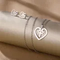 Silver stainless steel set with hollow heart and cross necklace and stud earrings - Heart Cross (TZ-445)