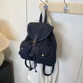 Vintage dark blue denim backpack with metal buckle straps and two front pockets - Dark Blue