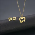 Golden double heart pendant necklace and earring set with hollow design on black base - Double Hearts Hollow Style (TZ-287 Gold)