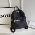 Minimalist black quilted nylon backpack with silver zippers and large capacity - Black