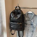 Glossy black quilted puffer backpack with a spacious main compartment and front pocket - Black