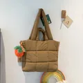 Brown quilted puffer tote bag with a cute plush carrot charm for daily wear - Khaki