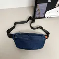 Dark blue denim waist bag with dual zippers and adjustable black nylon strap for casual wear - Dark Blue