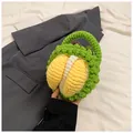 Detailed view of handmade crochet durian bag showing textured green and yellow yarn loops - Handbag Style