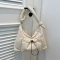 Minimalist beige quilted puffer tote bag with adjustable drawstring and knotted strap - White