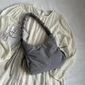 Grey padded space cotton shoulder bag featuring pleated cloud strap and side ribbon - Gray