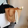 Brown woven tote bag with dark faux leather handles and white lace ribbon decoration - Khaki