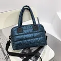 Quilted puffer tote bag in glossy dark blue with adjustable woven shoulder strap - Green