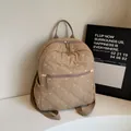 Quilted backpack for women featuring white bow embroidery and front zipper pocket - Khaki
