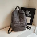 Minimalist grey quilted cotton backpack with double zip pockets and padded top handle - Gray