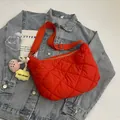 Bright red quilted lattice nylon crossbody bag with cute floral charm and silver buckles - With Pendant / Red