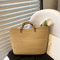 Retro beige woven tote bag with dark natural bamboo handles for summer vacations - Brown