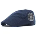 Detailed view of navy cotton flat cap showing retro embroidery badge and fine stitching - Adjustable / Navy Blue