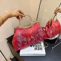 Red brocade shell clutch bag with floral jacquard and pearl rhinestone handle - Red
