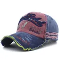 Detail of distressed baseball cap with Rock Rebel embroidery and frayed edges - Adjustable / Navy Brim Wine Red Top