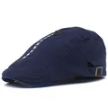 Detail of dark blue cotton cap with decorative zipper and white FOLLOW ME text - Navy Blue