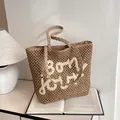 Khaki Strohtasche mit weißer bon jour Bestickung und gewebten Griffen für den Sommer - Khaki und Weiß