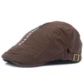Detail view of cotton flat cap featuring decorative zipper and FOLLOW & ME lettering - Coffee