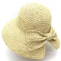 Détail d'un chapeau de soleil en raphia à large bord avec élégant nœud tressé - M (56-58cm) / Poche zippée