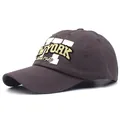 Detailed embroidery of New York 1946 on dark brown cotton baseball cap fabric - Gray